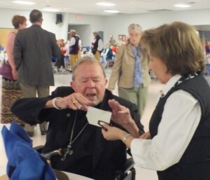 Bishop John Yanta sharing Christmas Opłatek at the annual Fr. Leo. Moczygemba Gala